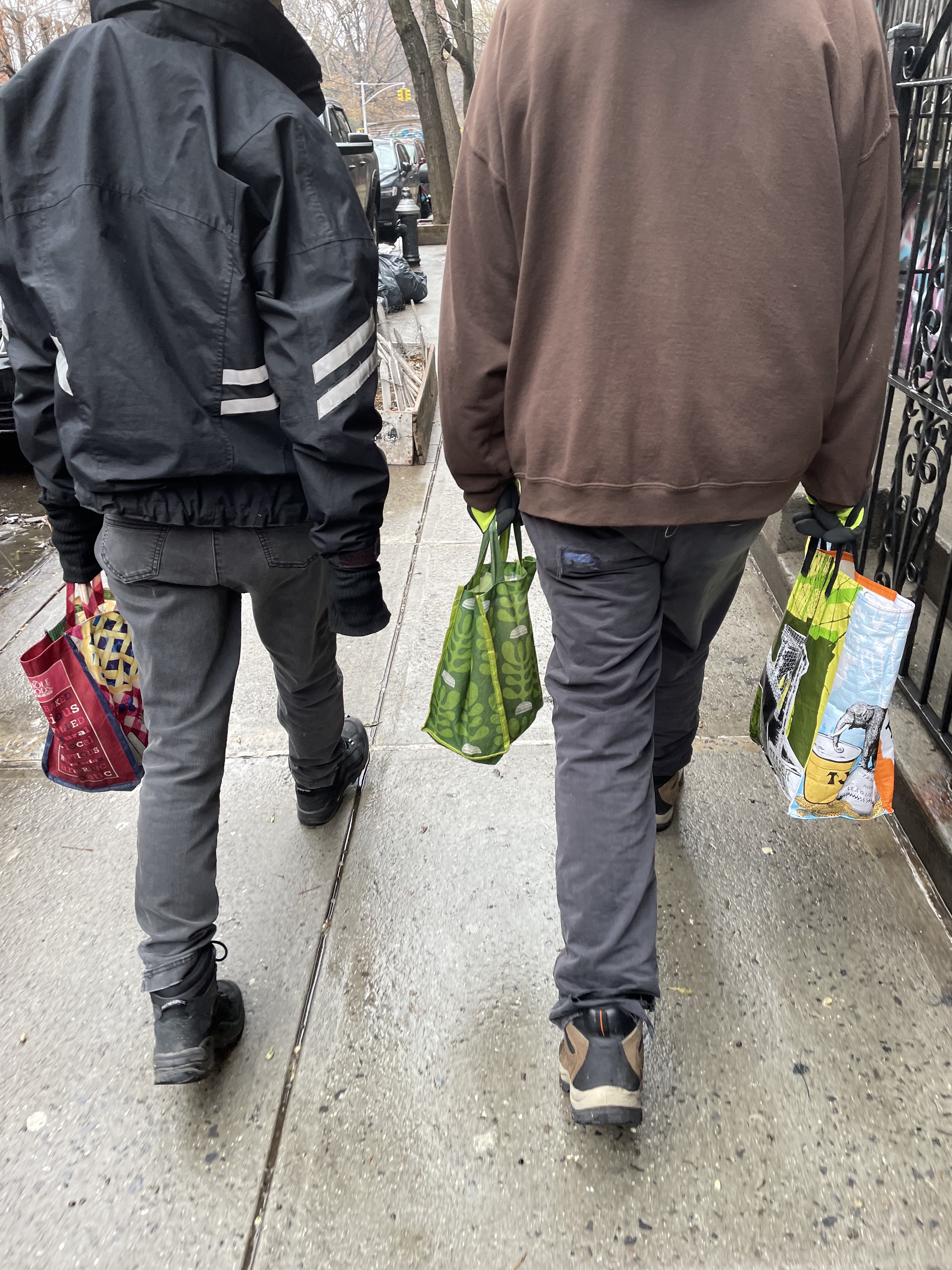 Back of old couple walking in front