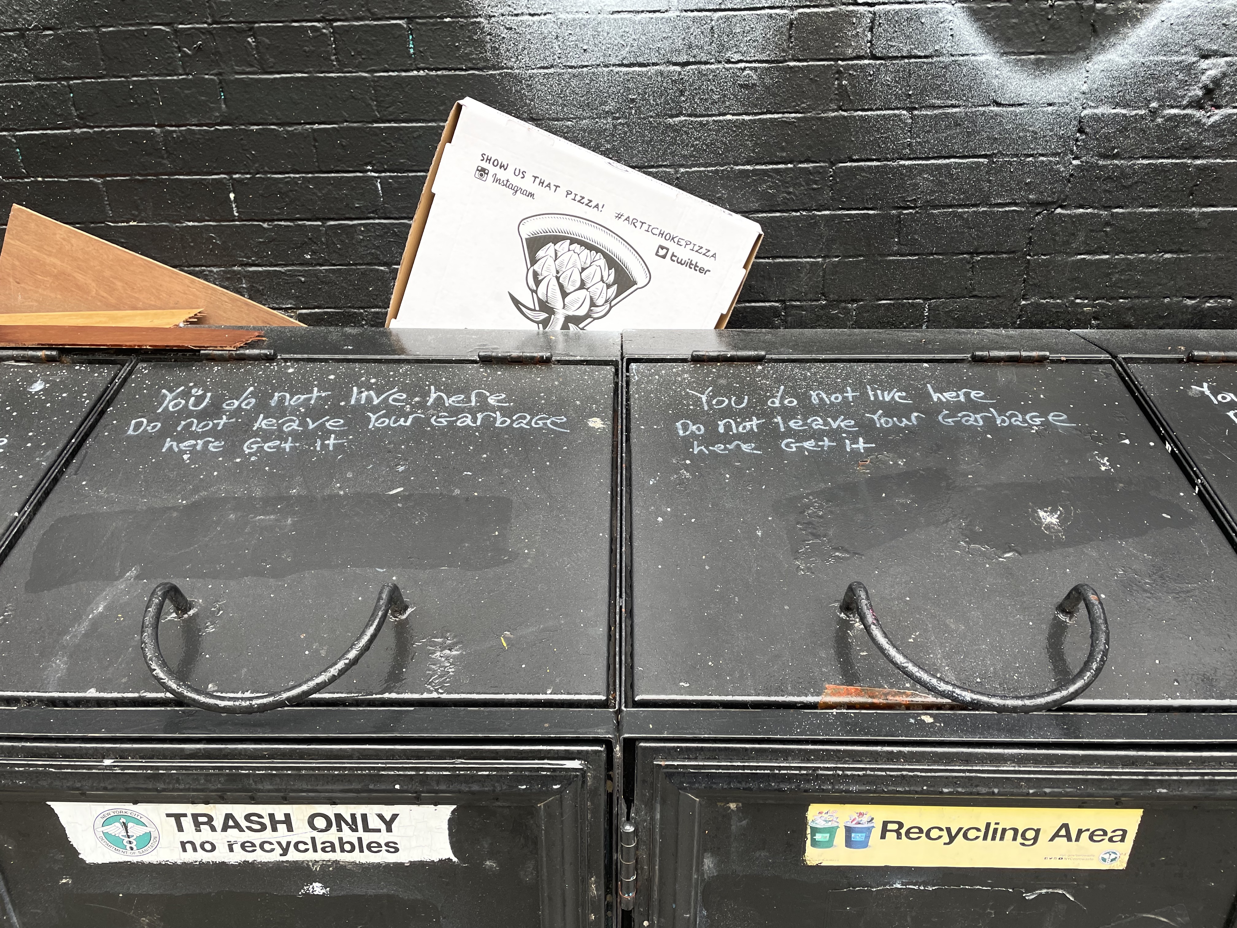 Words written on trash bin lids